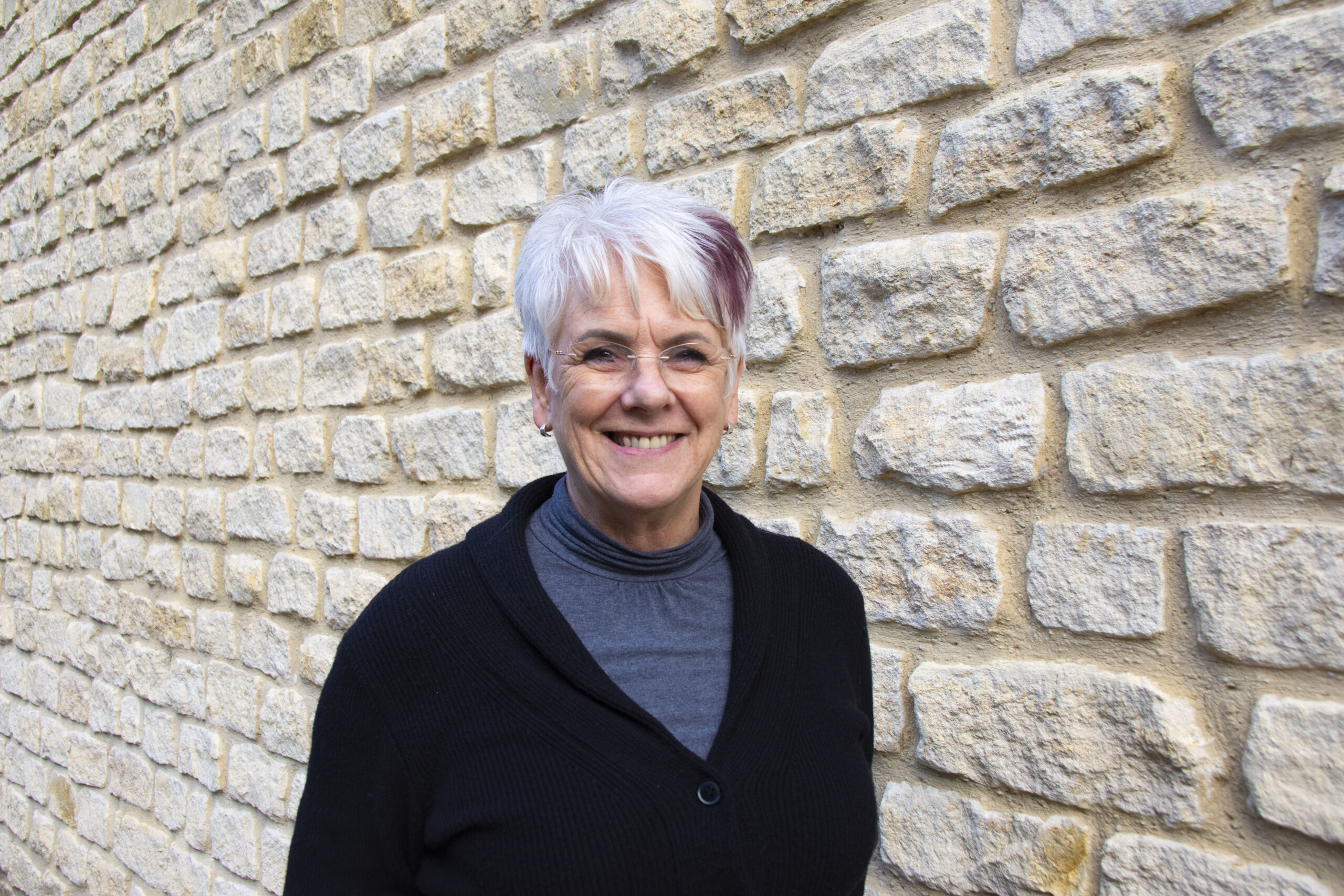 Photograph of Joanne Hobbs standing next to The Growth Hub Cirencester